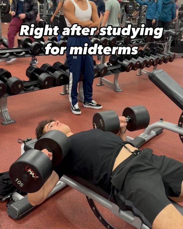Josh bench pressing dumbbells, captioned right after studying for midterms
