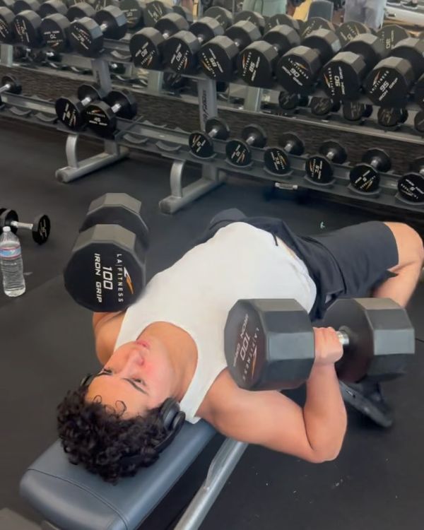 Josh doing a dumbbell bench press with 100 pound dumbbells